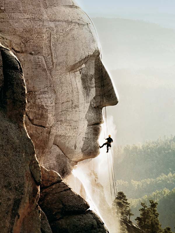 Man Pressure Cleaning Mount Rushmore